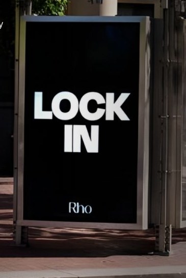 Rho Lock In campaign on a street kiosk in a startup corridor